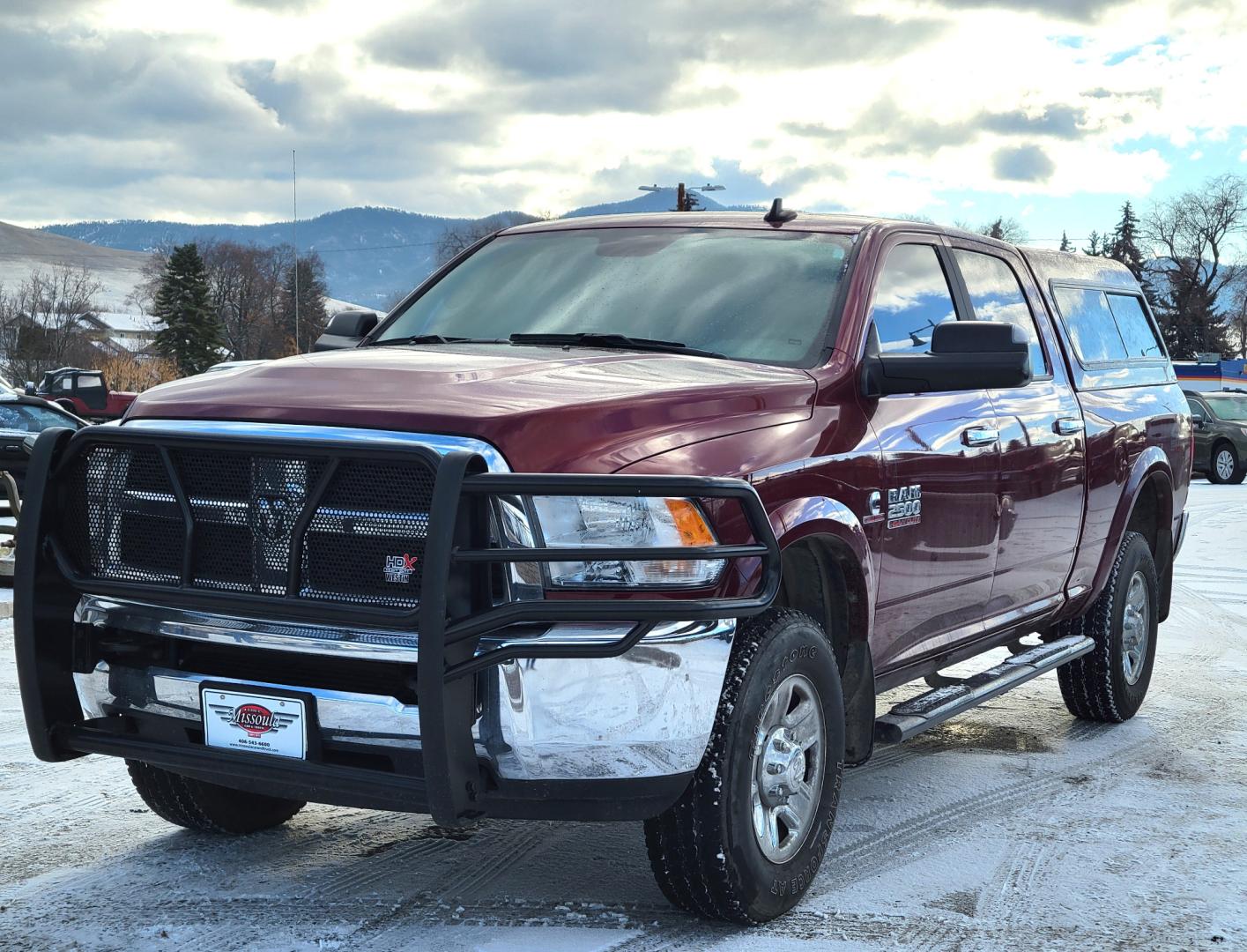 2018 Maroon /Black RAM 2500 SLT (3C6UR5DL4JG) with an 6.7 L Cummins Turbo Diesel engine, 6-Speed Automatic transmission, located at 450 N Russell, Missoula, MT, 59801, (406) 543-6600, 46.874496, -114.017433 - Only 12,839 Miles. Mint Condition/ 4 Wheel Drive. 6.7L Cummins Turbo Diesel. 6 Speed Automatic Transmission. Matching Topper. Touchscreen Display. AM FM Bluetooth. Power Drivers Seat. Air. Cruise. Tilt. Power Windows and Locks. Backup Camera. - Photo#3